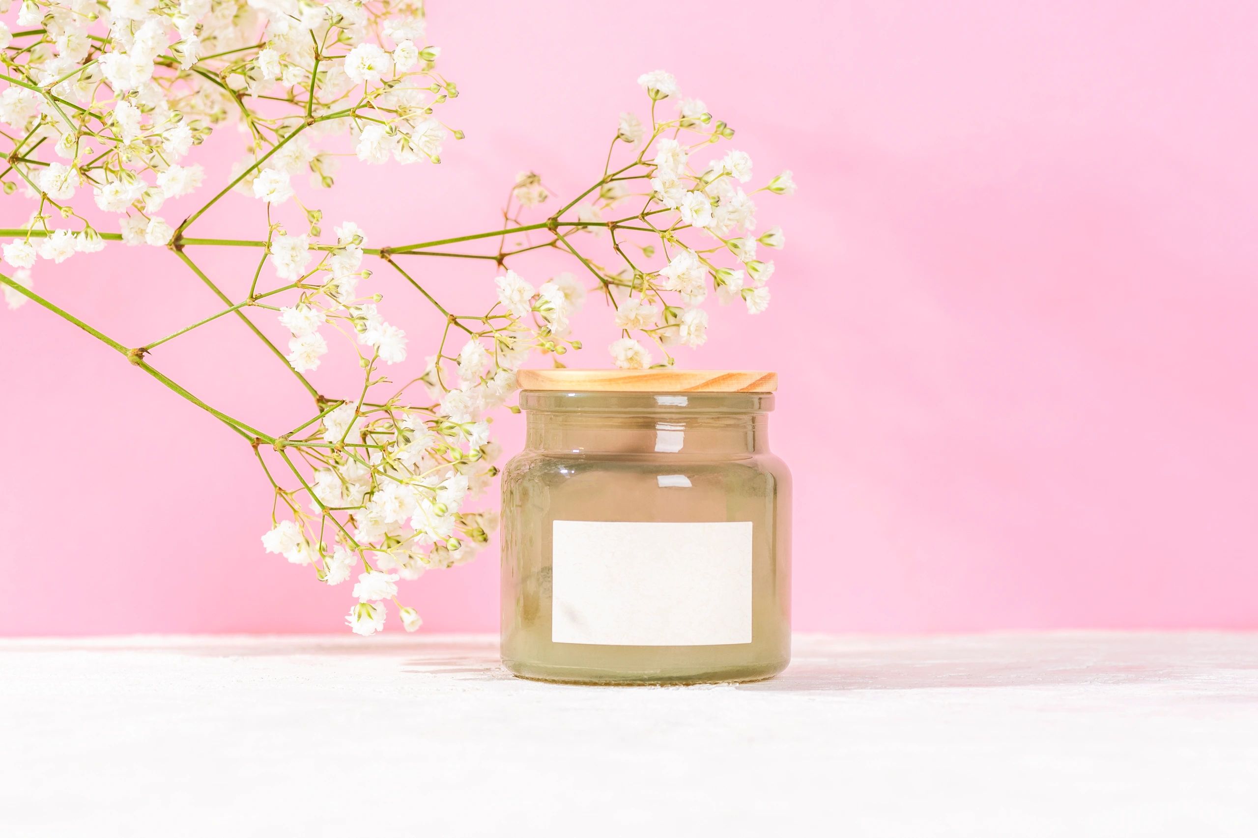 creamy white soy candle in frosted glass jar, minimal label, soft background, elegant product photography